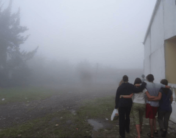 Being together during Day of the Dead fog in Pasac, Guatemala